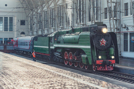 Moscow, Russia - July 17, 2021: Retro train departs from the platform.のeditorial素材