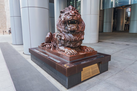 Hong Kong - December 10, 2016: Bronze lion statue at the entrance of HSBC bank Office in Hong Kong Central District.のeditorial素材
