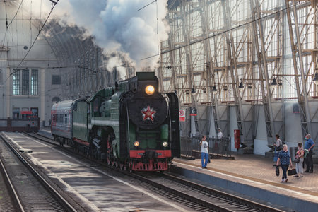 Moscow, Russia - July 17, 2021: Retro train departs from the platform.のeditorial素材