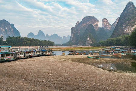 Boats on Li River at sunrise. Yangshuo. Guangxi Province. China.の写真素材