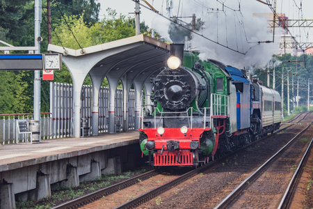 Retro train departs from the platform. Moscow region. Russia.
