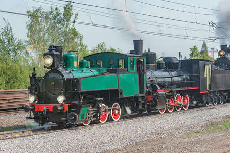Steam retro train departs from the station. Moscow. Russia.