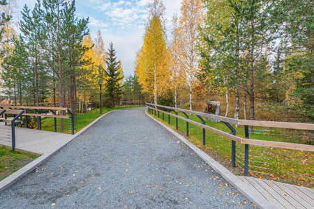 Path in the mountain city park at autumn evening.の写真素材