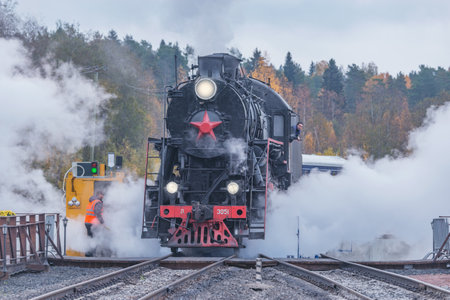 Ruskeala, Russia - October 01, 2021: Retro steam locomotive at the turning circle. Ruskeala Mountain Park railway station.のeditorial素材
