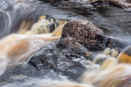 Waterfall in the canyon. Ruskeala Mountain Park. Republic of Karelia. Russia.の写真素材