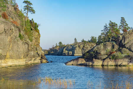 Small islands of Lake Ladoga at autumn evening. Republic of Karelia. Russia.の写真素材
