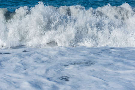 Wave of the sea water at sunny day time.の写真素材