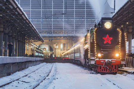 Moscow, Russia - January 05, 2022: New year steam retro train stands by the platform.のeditorial素材