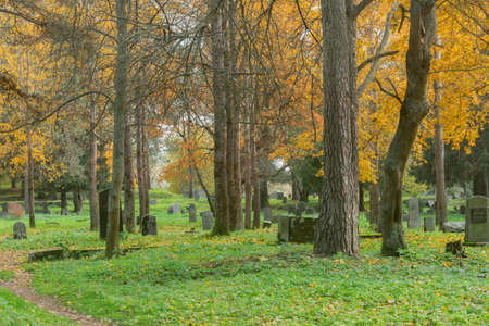 Old finnish cemetery at autumn day.の写真素材