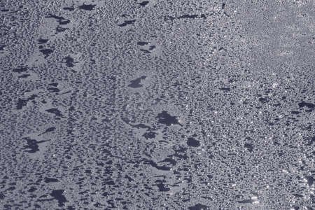 Water drops on the new asphalt road surface.の写真素材