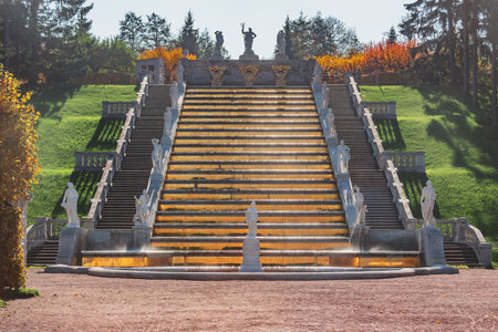 Peterhof, Saint Petersburg, Russia - October 04, 2021: Cascade fountain Gold Mountain in Lower park of Peterhof at autumn day time.のeditorial素材