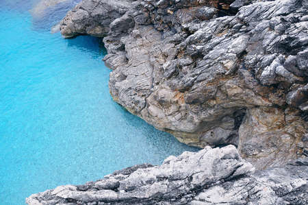 Colorful cliffs by the water edge. Natural reserve Zingaro. Sicily. Italy.の写真素材