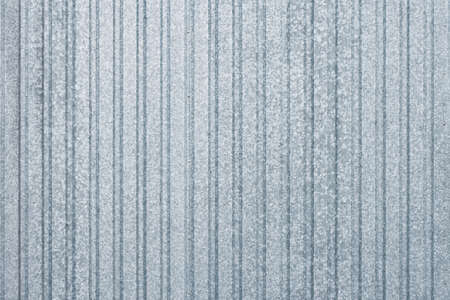 White and gray corrugated metal fence background.の写真素材