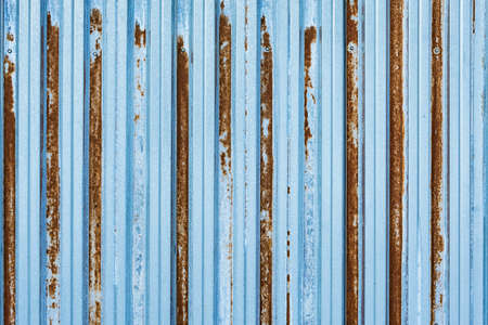Metal rusty texture. Corrugated metal fence background.の写真素材