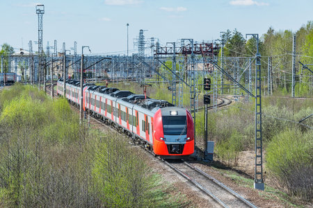 Passenger train moves at summer morning time.の写真素材