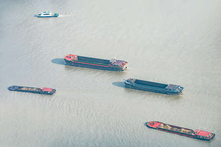 Freight move ships on the river surface. Shanghai. China.の写真素材