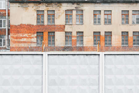 Concrete fence with barbed wire of the prison.の写真素材