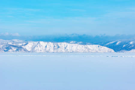 Frozen surface of Baikal lake at sunset.の写真素材