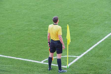 Referee from the sidelines of a soccer game.の写真素材