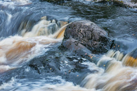 Waterfall in the deep canyon. Finland.の写真素材