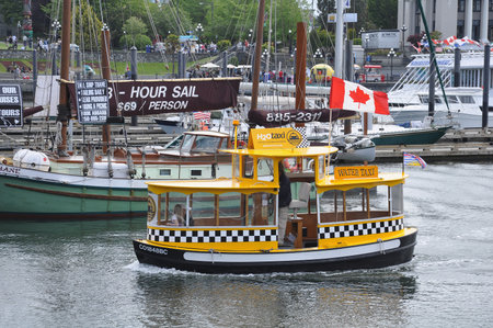 Victoria, Canada - June 19, 2011: Water taxi boats in the city port.のeditorial素材