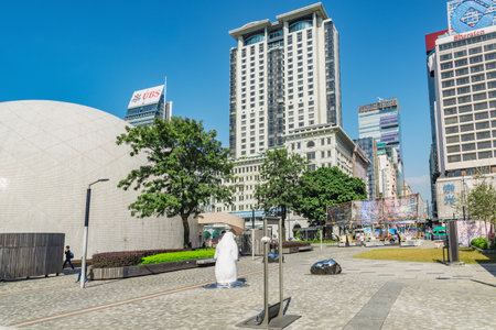 Kowloon, Hong Kong - December 12, 2016: Peninsula and Sheraton hotels on the city street.のeditorial素材