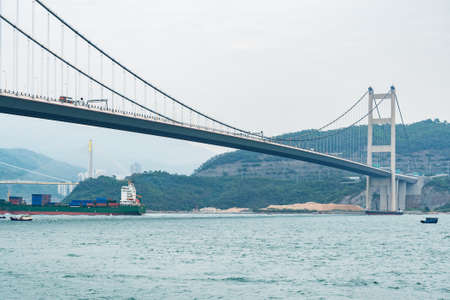 Suspension bridge to the Park island. hong kong.の写真素材