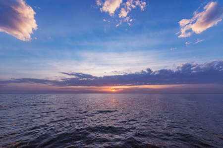 Sunset sky over the calm surface,の写真素材