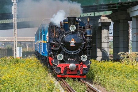 Saint Petersburg, Russia - August 06, 2022: Steam train of Childrens railway approaches to the station.のeditorial素材