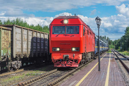 Touristic train stands by the platform before departure.の写真素材