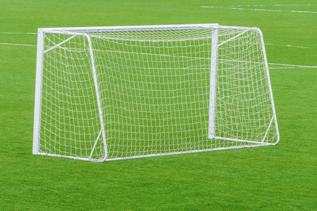Football gate on the green grass field.の写真素材