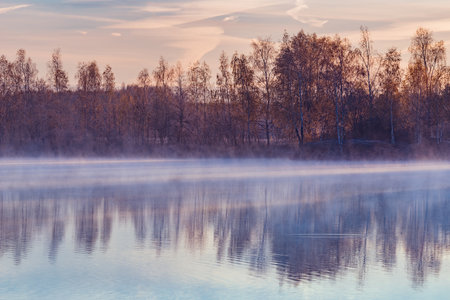 Fog above the lake at cold morning.の写真素材