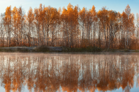 Fog above the lake at cold morning.の写真素材