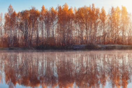 Fog above the lake at cold morning.の写真素材