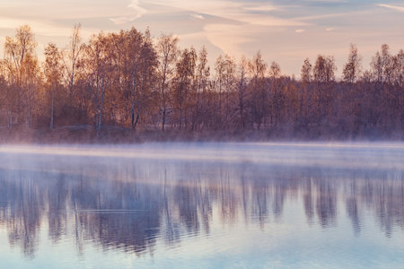 Fog above the lake at cold morning.の写真素材