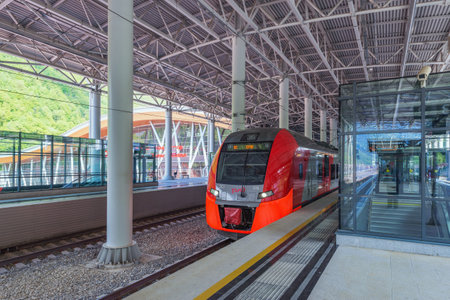 Roza Khutor station, Russia - May 12, 2015: Passenger trains to Sochi stands by the platform before departure.のeditorial素材