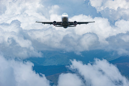 Flight of the passenger plane above the clouds.の写真素材