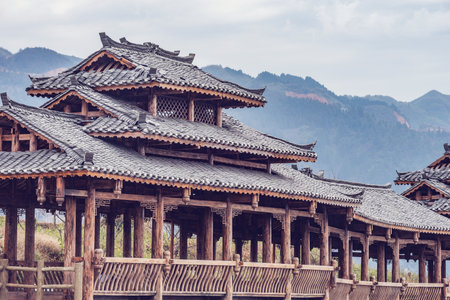 Wooden pavilion on the mountains background. China.の写真素材