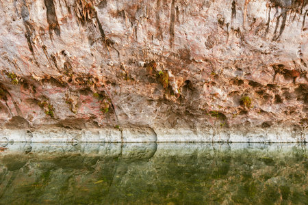 Colorful cliffs by the river water surface.の写真素材