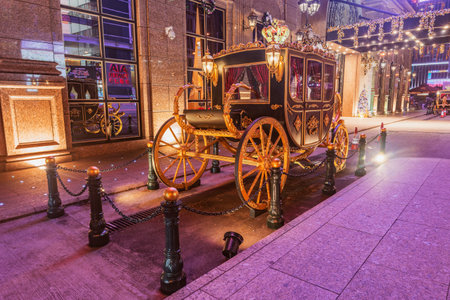 Macau - December 17, 2016: Retro carriage stands by the prestige hotel entrance.