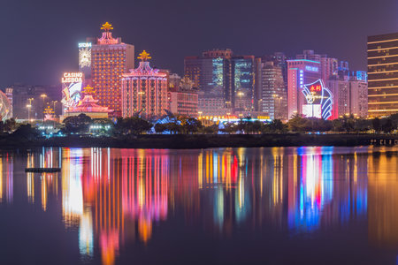 Macau - December 17, 2016: Casinos by the sea coast at evening time.のeditorial素材