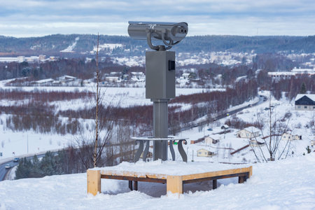 Binoculars on the mountain viewpoint at winter day.の写真素材
