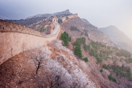Great Wall of China at winter sunrise.の写真素材