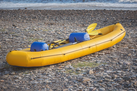 Inflatable boat on the seashore at sunset.の写真素材