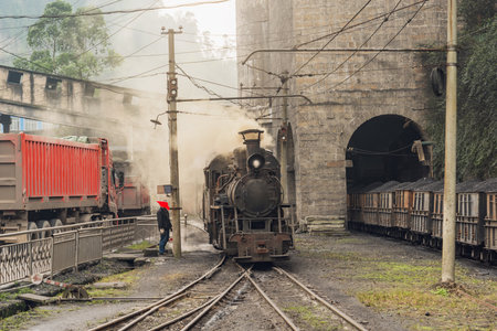 Carriages with coal and steam locomotive. Yuejin. Jiayang Mining Region. Sichuan province. China.の写真素材