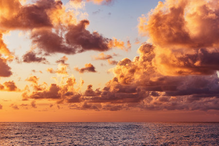 Amazing sunset sky above the sea surface.の写真素材