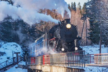 Retro steam train moves above the river.