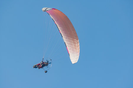 Paraplane on the blue sky background. Extreme sport.