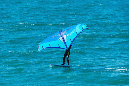 Windsurfer on the sea surface at morning.