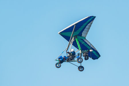 Hang glider flying in the sky.